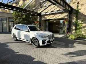 BMW X7 in front of Hotel Door